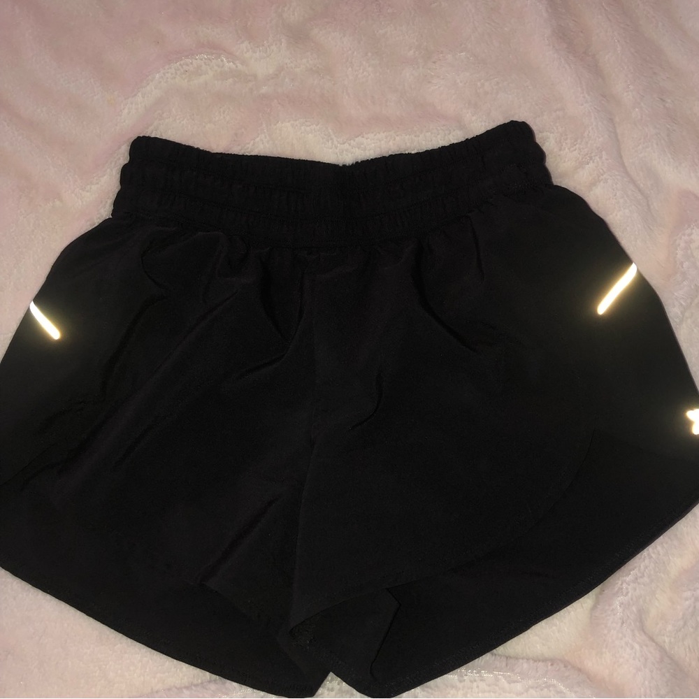 black athletic all in motion shorts with reflective stripes